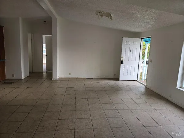 a view of a kitchen with furniture and windows