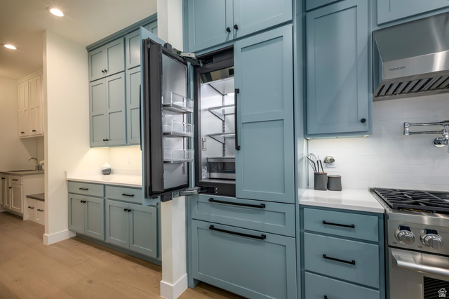 250 South Main Street, Unit 25 Alpine, UT 84004 - Photo 23 of 31 Kitchen featuring gas range, light wood-style floors, paneled built in refrigerator, recessed lighting, and blue cabinetry