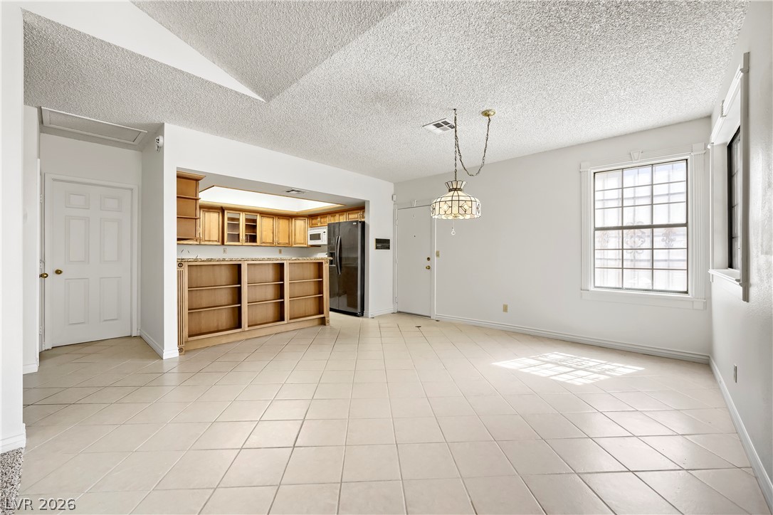 251 North Cimarron Road Las Vegas, NV 89145 - Photo 4 of 15 Dining area w/direct garage & breakfast bar to kitchen