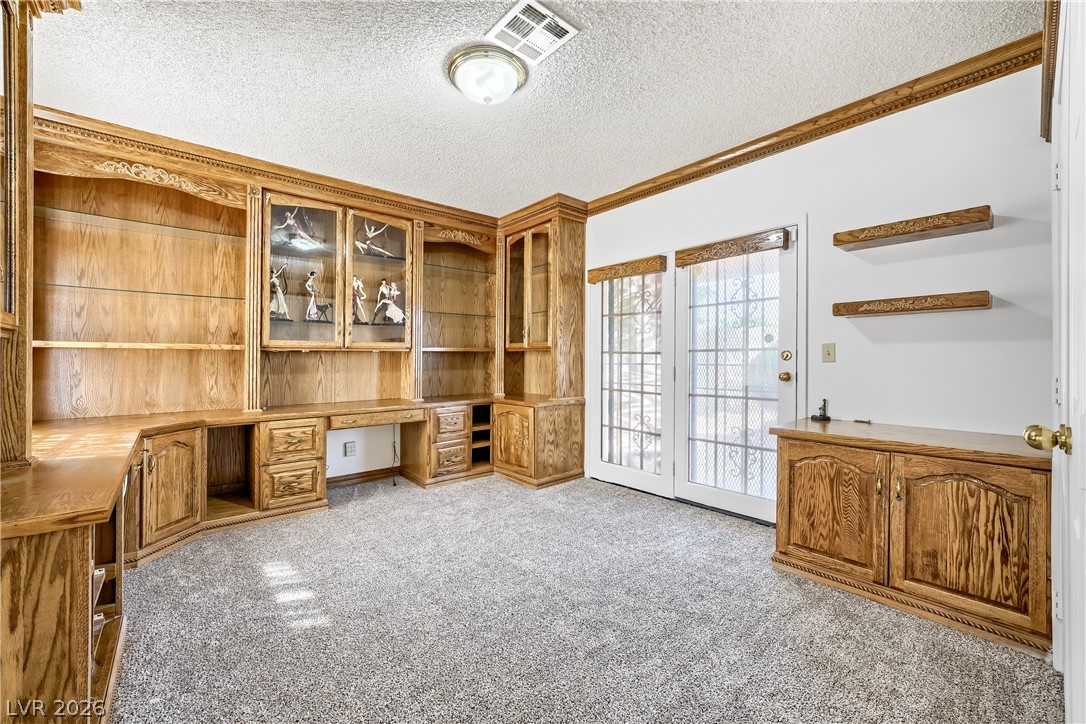 251 North Cimarron Road Las Vegas, NV 89145 - Photo 7 of 15 Secondary office/bedroom w/French doors to back and custom wood cabinetry
