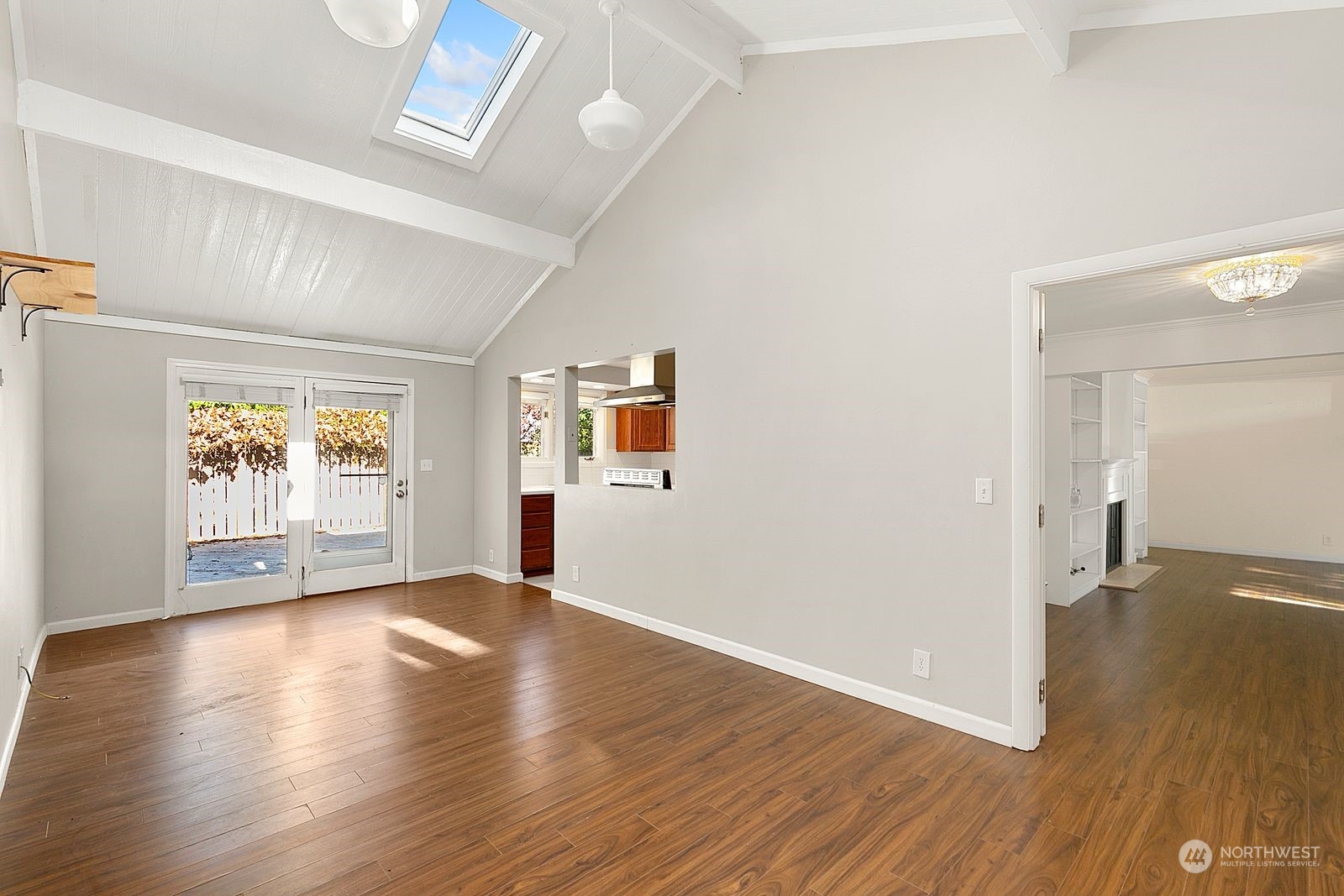 2336 North 135th Street Seattle, WA 98133 - Photo 5 of 17 an empty room with wooden floor and windows
