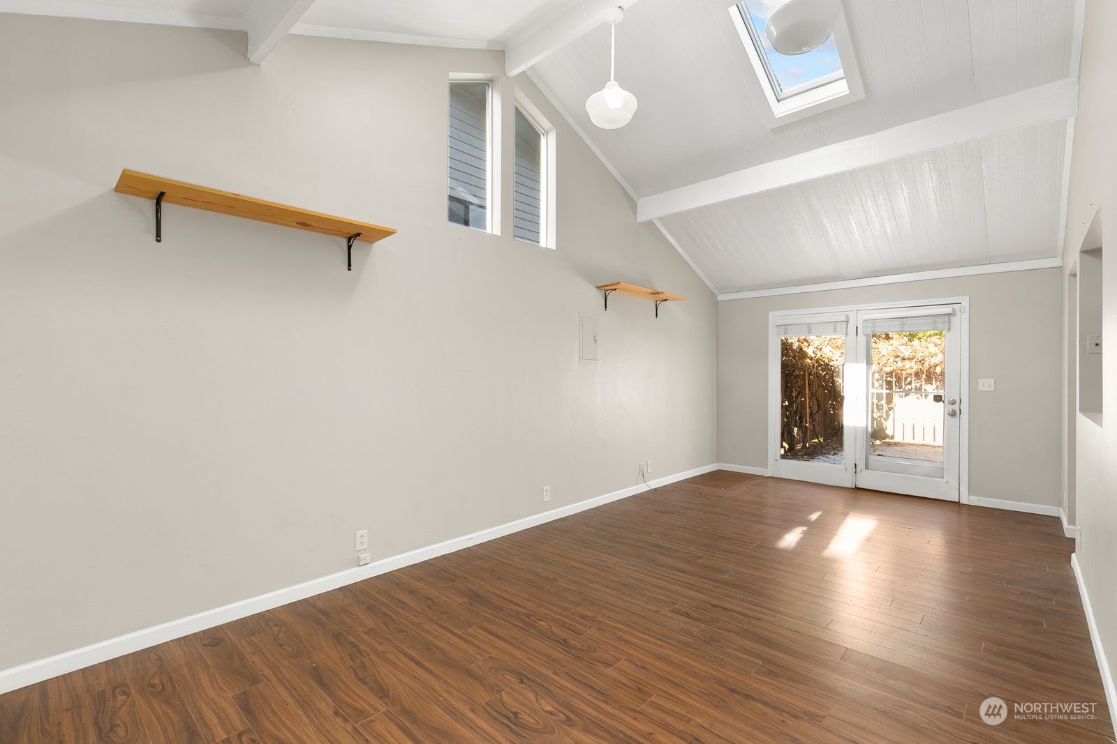 2336 North 135th Street Seattle, WA 98133 - Photo 6 of 17 an empty room with wooden floor and windows