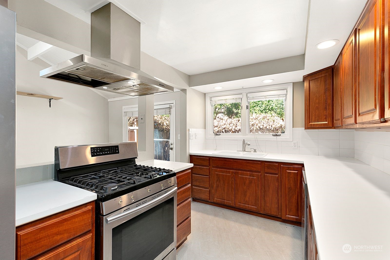 2336 North 135th Street Seattle, WA 98133 - Photo 9 of 17 a kitchen with a stove and a window