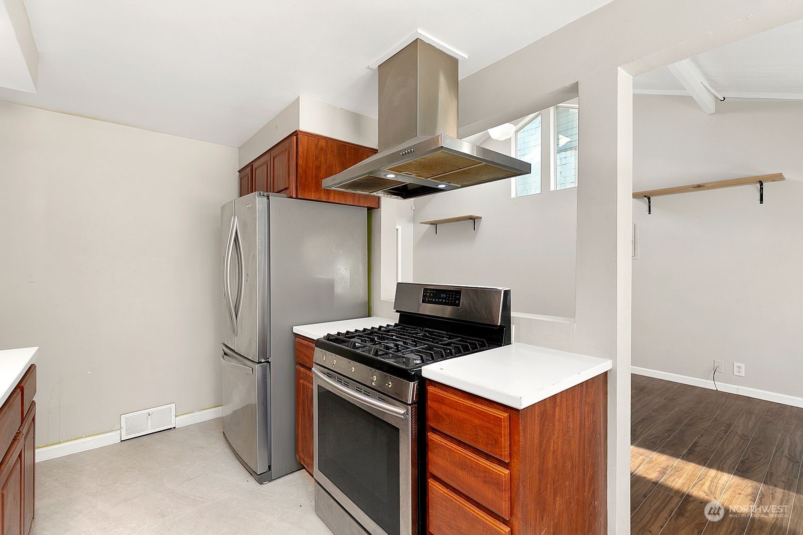 2336 North 135th Street Seattle, WA 98133 - Photo 10 of 17 a kitchen that has a stove and a refrigerator