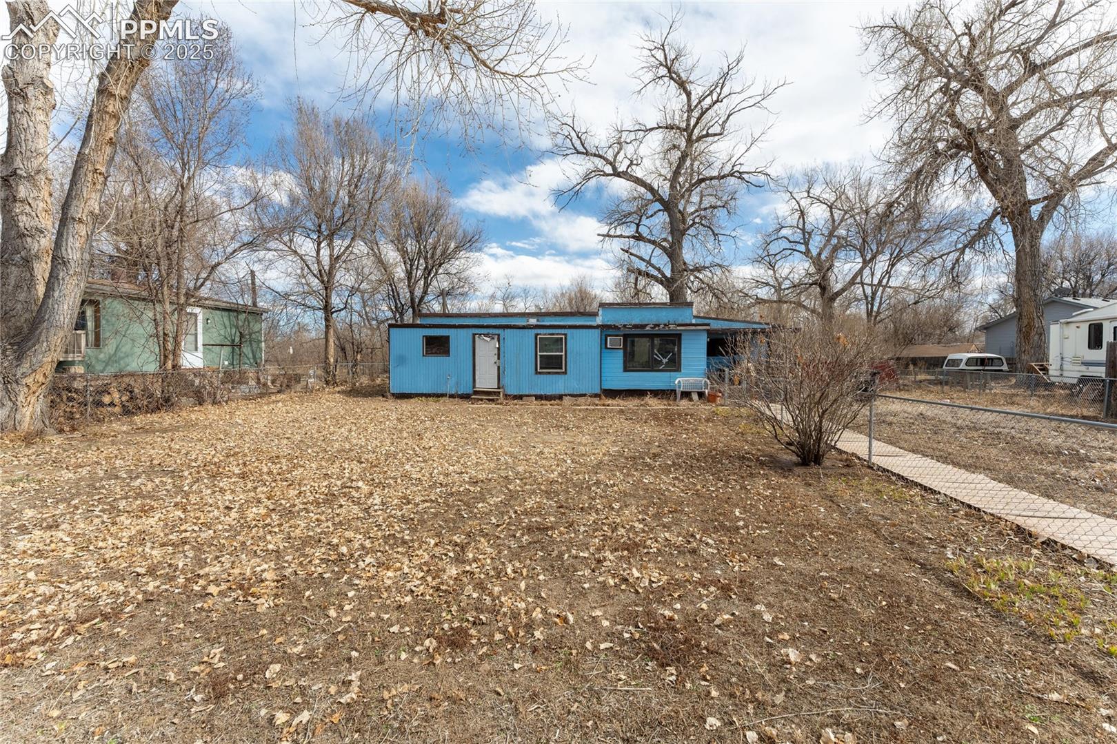 View of front of property featuring fence