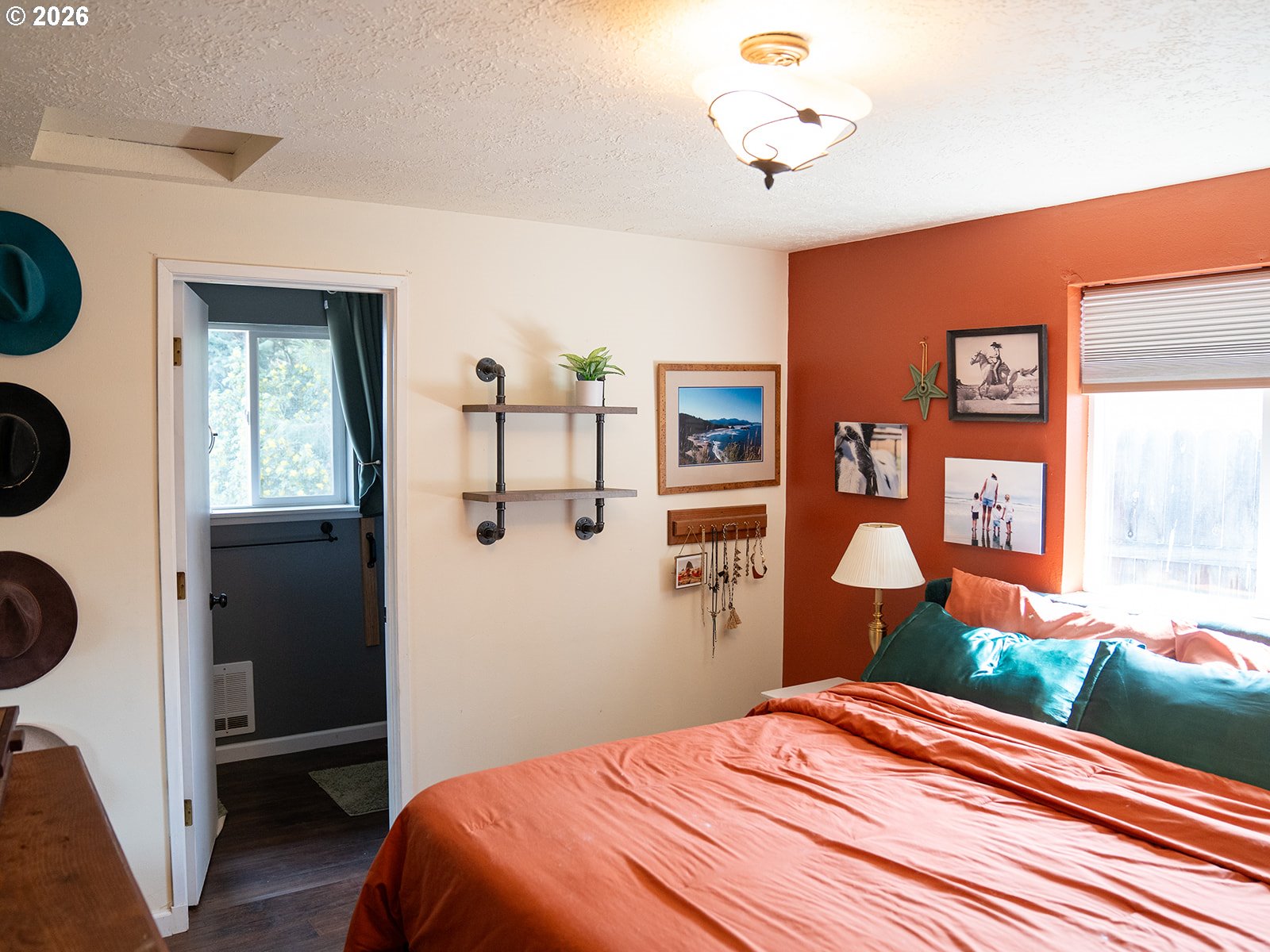 1923 Southwest 20th Street Redmond, OR 97756 - Photo 11 of 17 a bedroom with a bed and a window