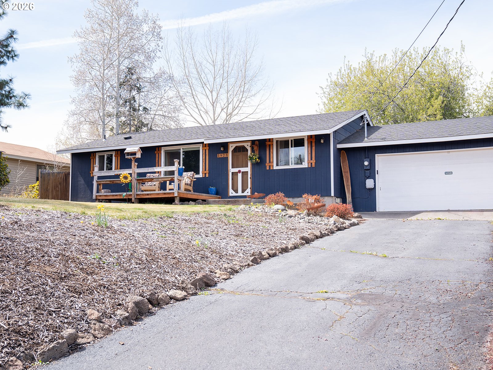 1923 Southwest 20th Street Redmond, OR 97756 - Photo 2 of 17 front view of a house with a yard and trees
