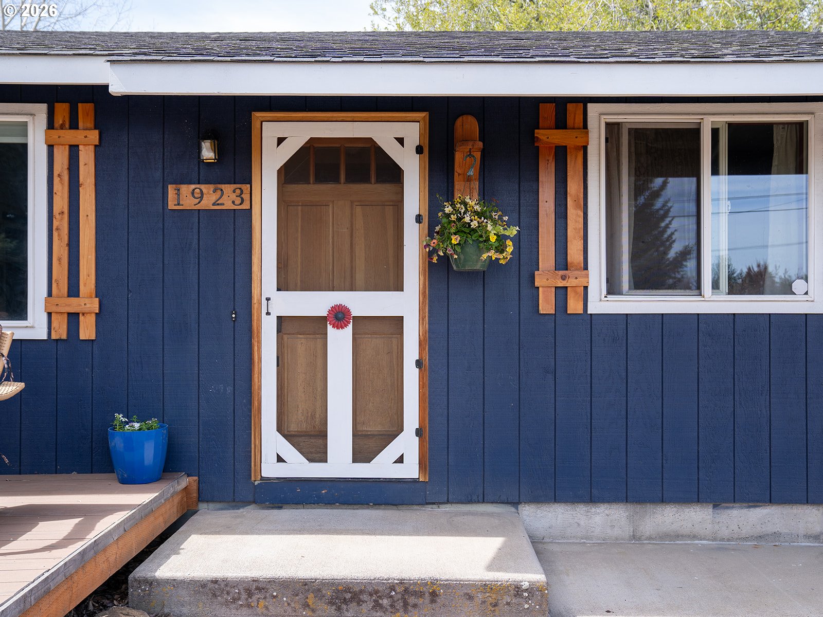 1923 Southwest 20th Street Redmond, OR 97756 - Photo 3 of 17 a front view of a house with a blue gate