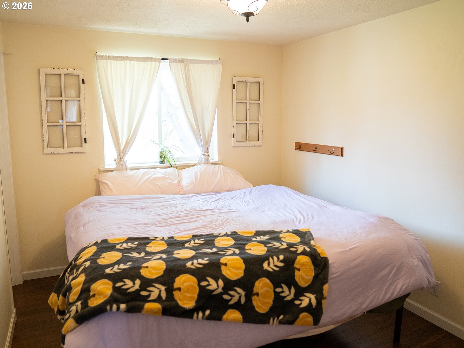 1923 Southwest 20th Street Redmond, OR 97756 - Photo 10 of 17 a bedroom with a bed and a window