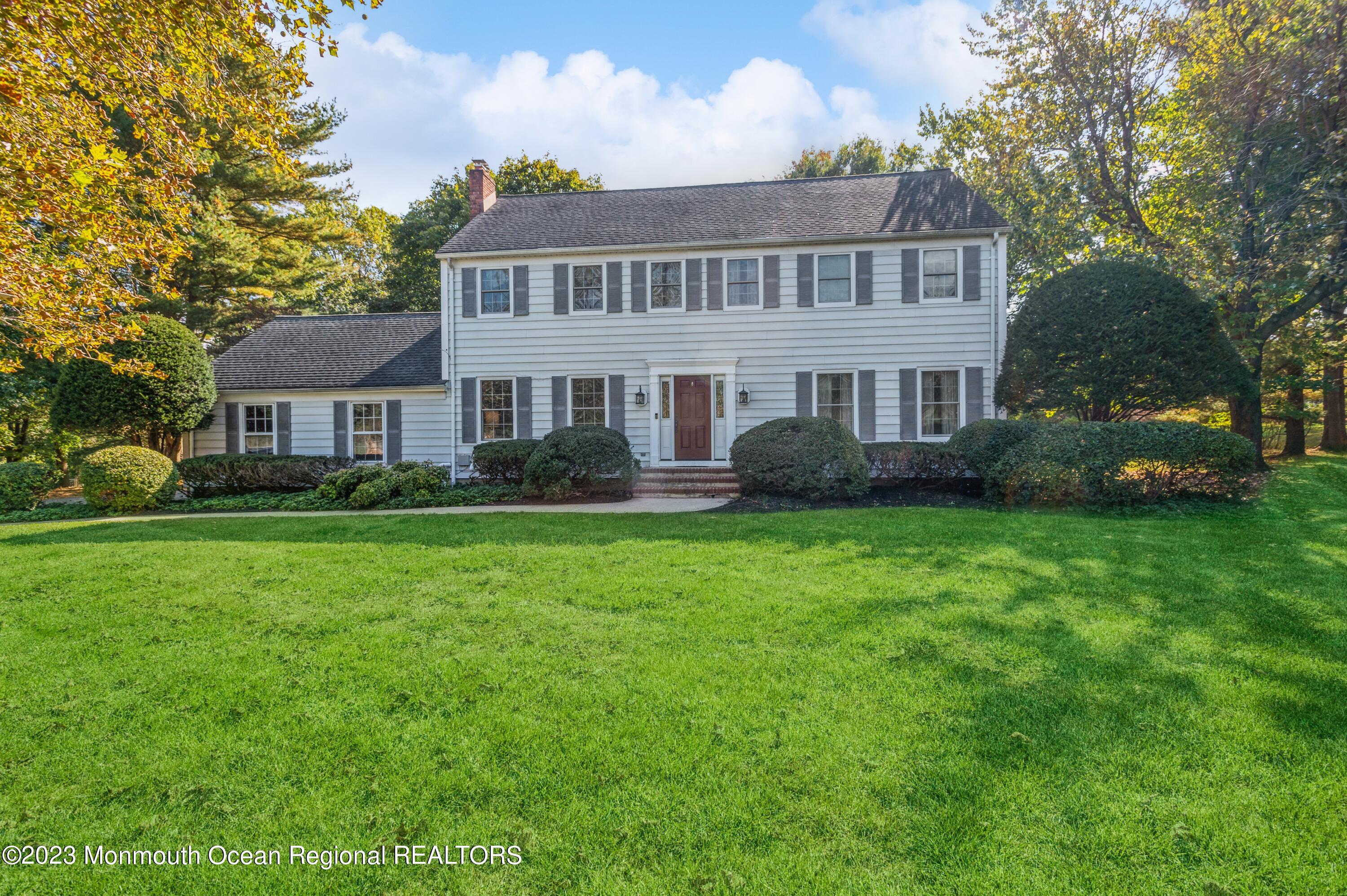 43 McCampbell Road Holmdel, NJ 07733 - Photo 1 of 25 a front view of a house with a yard and trees