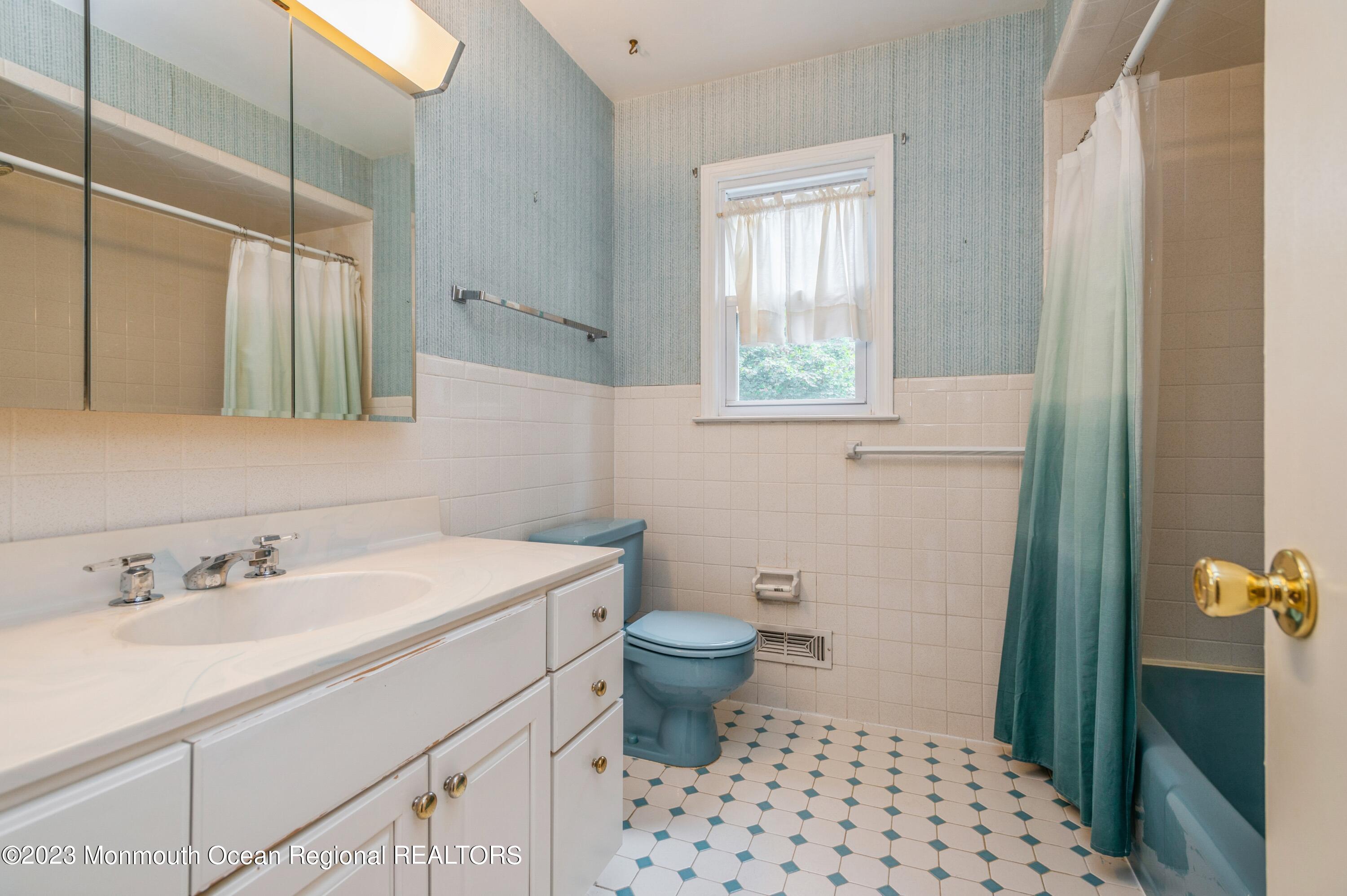 43 McCampbell Road Holmdel, NJ 07733 - Photo 21 of 25 a bathroom with a sink toilet and shower