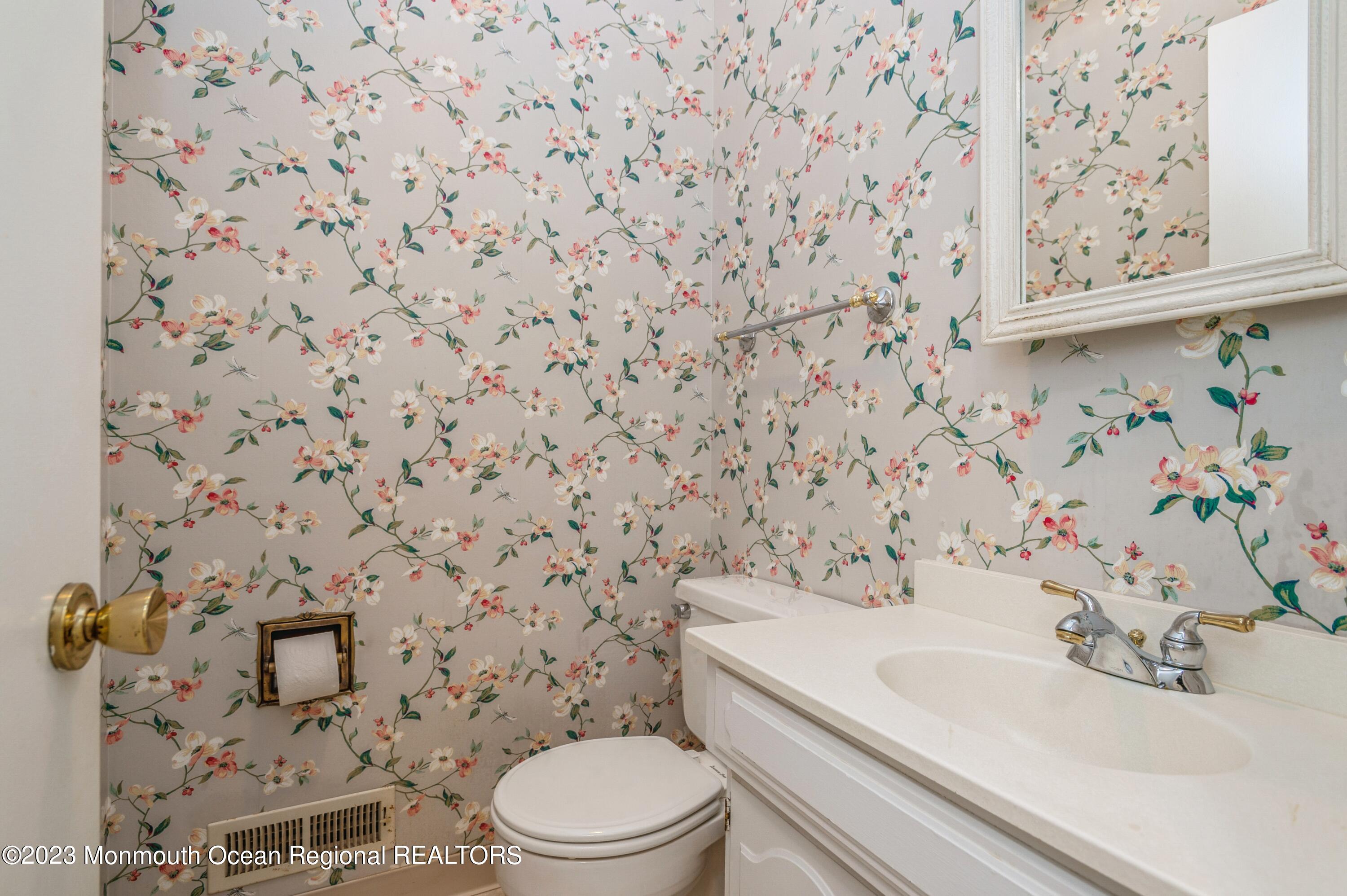 43 McCampbell Road Holmdel, NJ 07733 - Photo 23 of 25 a bathroom with a sink a toilet and a shower curtain