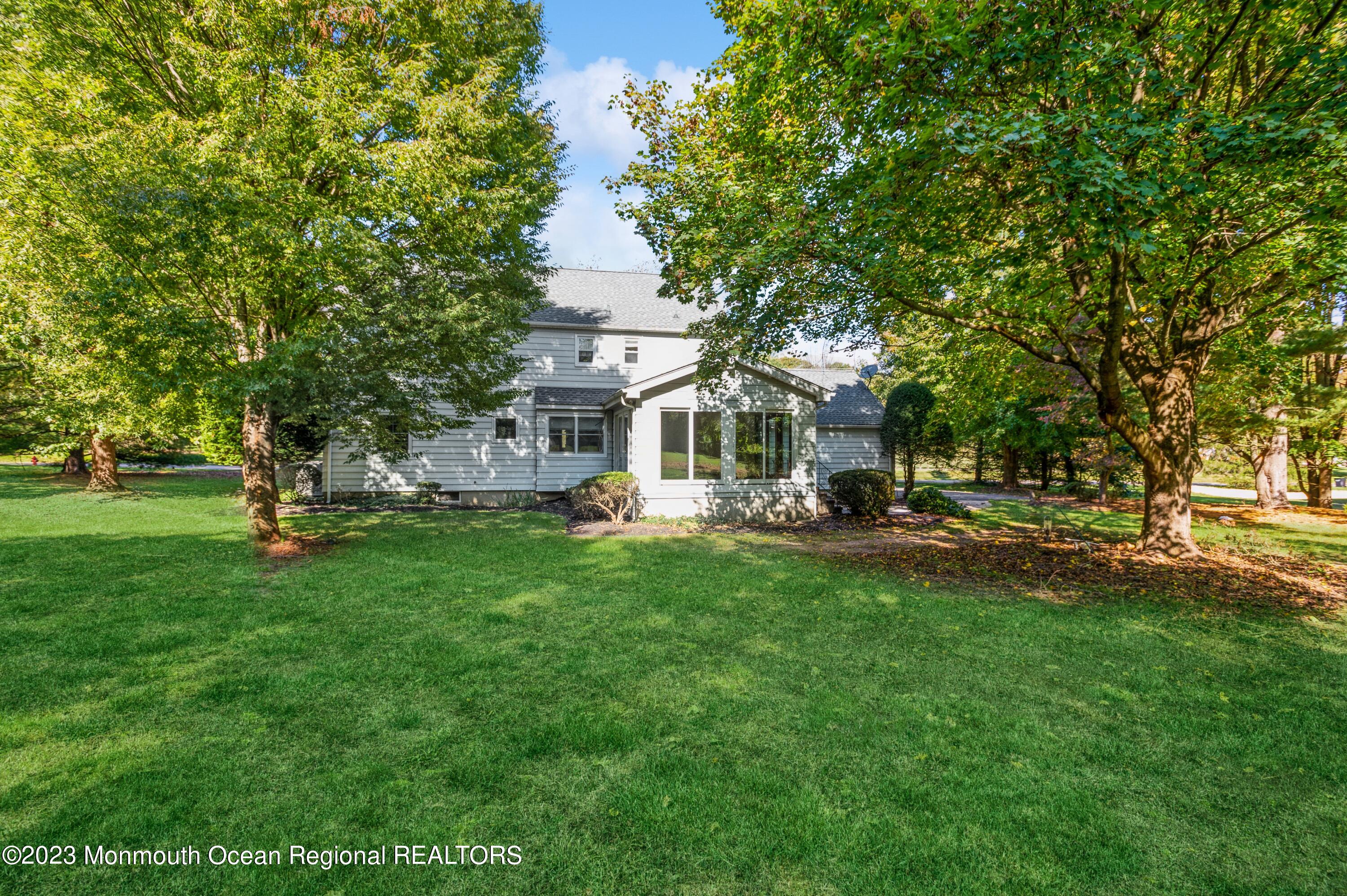 43 McCampbell Road Holmdel, NJ 07733 - Photo 24 of 25 a view of a house with backyard and a tree