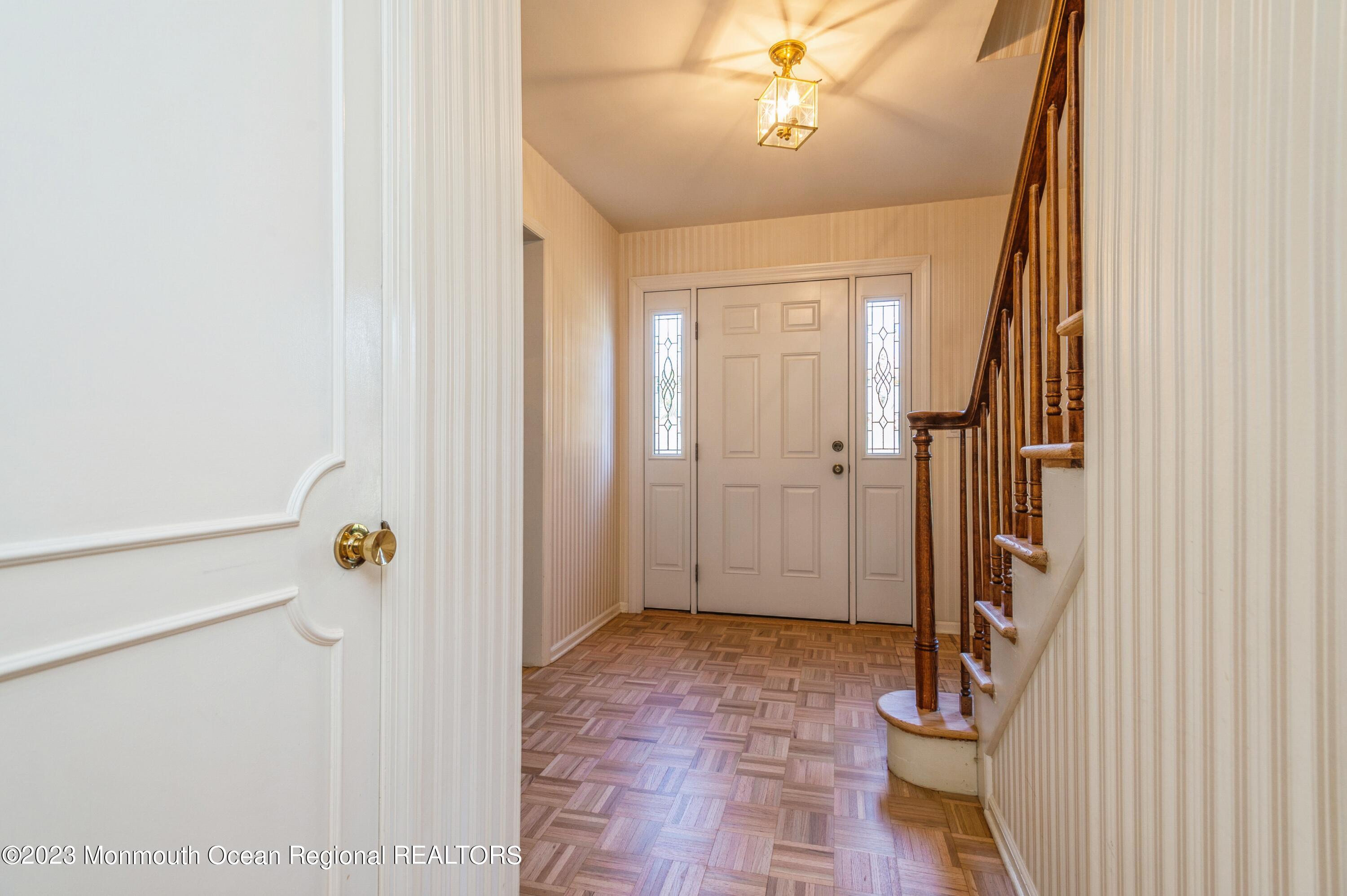 43 McCampbell Road Holmdel, NJ 07733 - Photo 3 of 25 a view of a hallway with a dining area