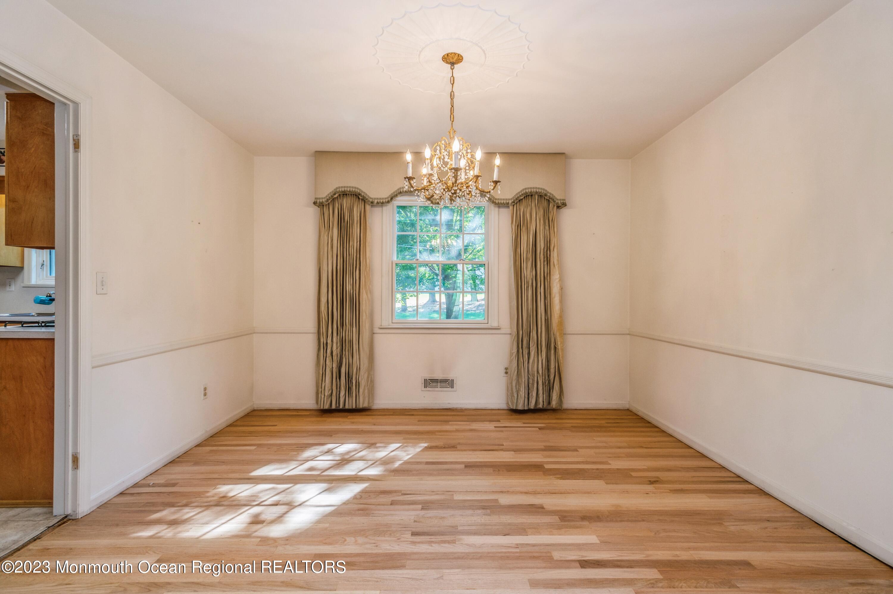 43 McCampbell Road Holmdel, NJ 07733 - Photo 8 of 25 a view of a room with window and wooden floor