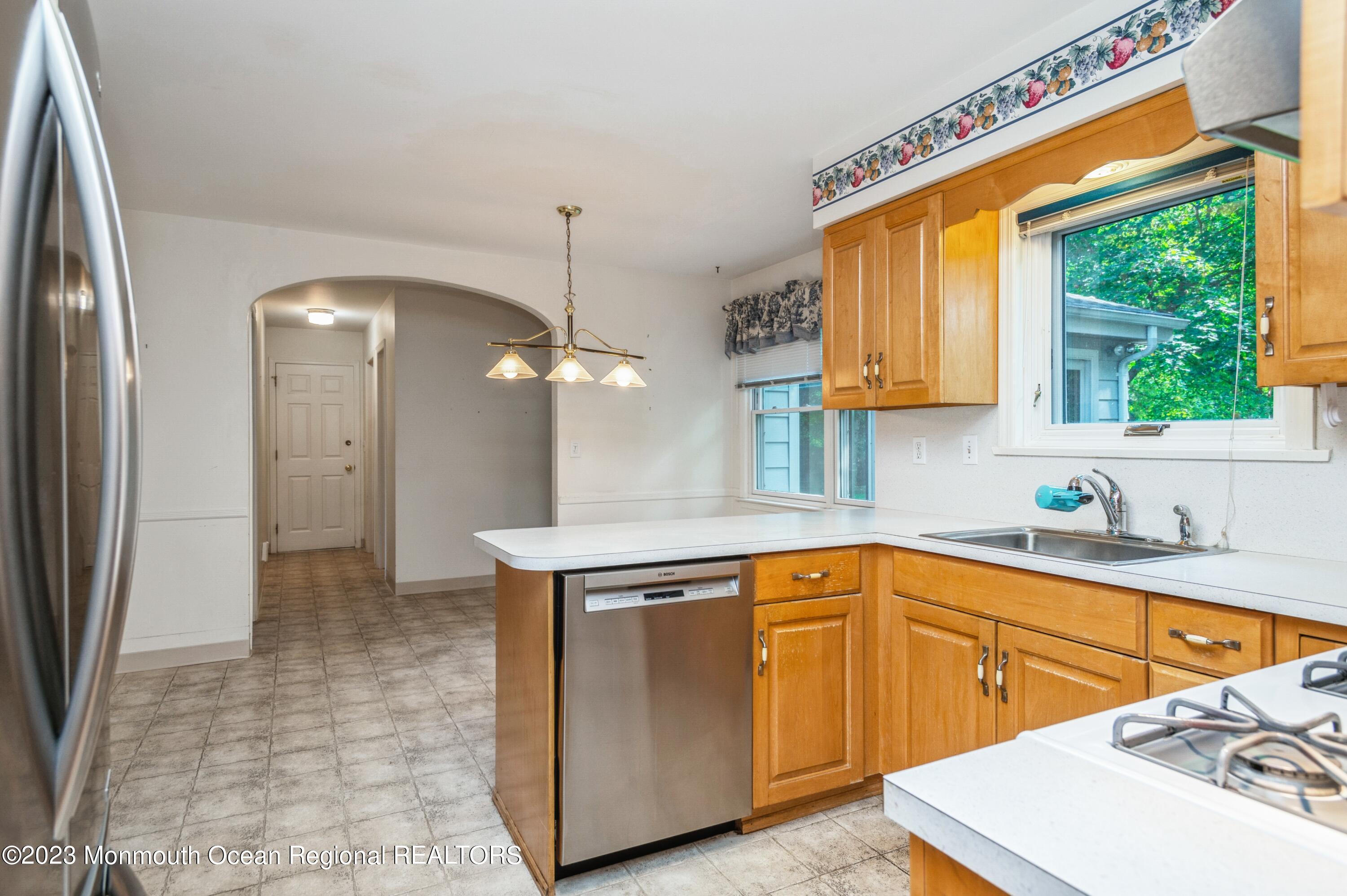 43 McCampbell Road Holmdel, NJ 07733 - Photo 9 of 25 a kitchen that has a sink a window and stainless steel appliances