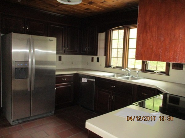 74 Chipaway Road Freetown, MA 02717 - Photo 8 of 26 a kitchen with a sink a refrigerator and window