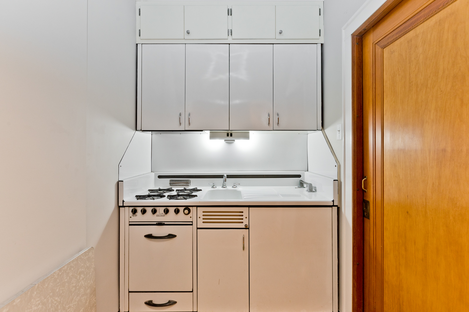 2950 Central Street, Unit 2 Evanston, IL 60201 - Photo 12 of 17 a kitchen with granite countertop cabinets and white appliances