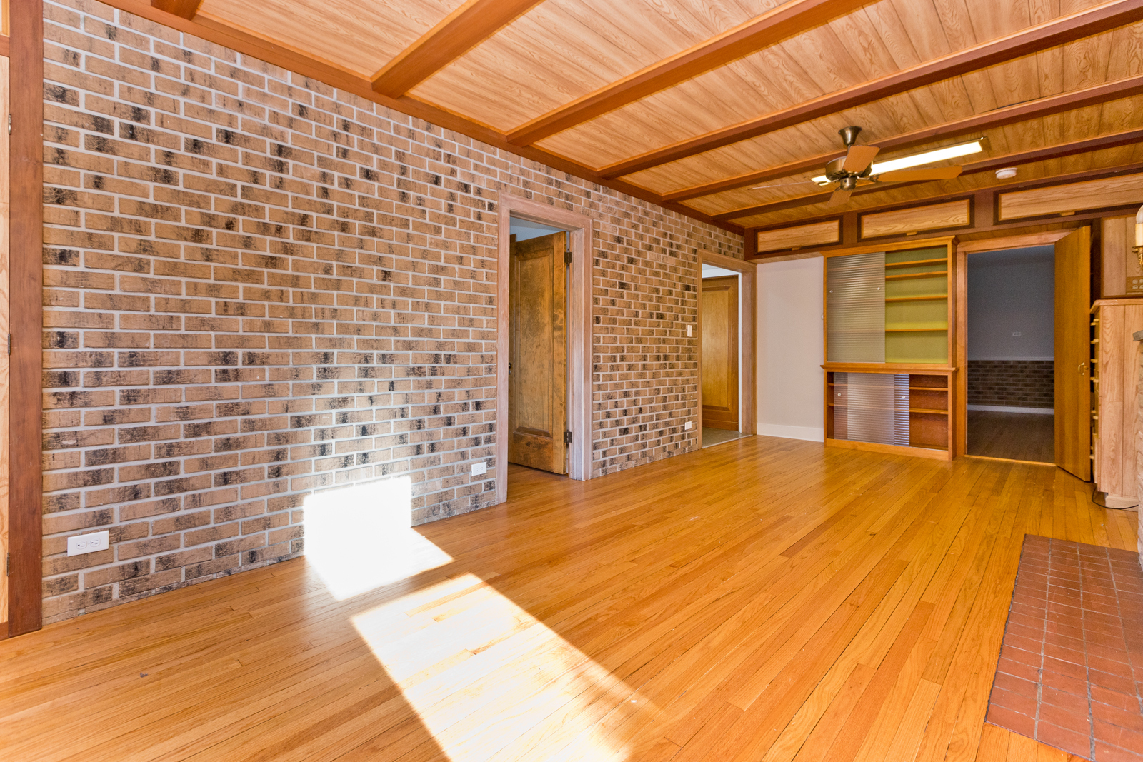 2950 Central Street, Unit 2 Evanston, IL 60201 - Photo 2 of 17 a view of empty room with wooden floor and cabinet