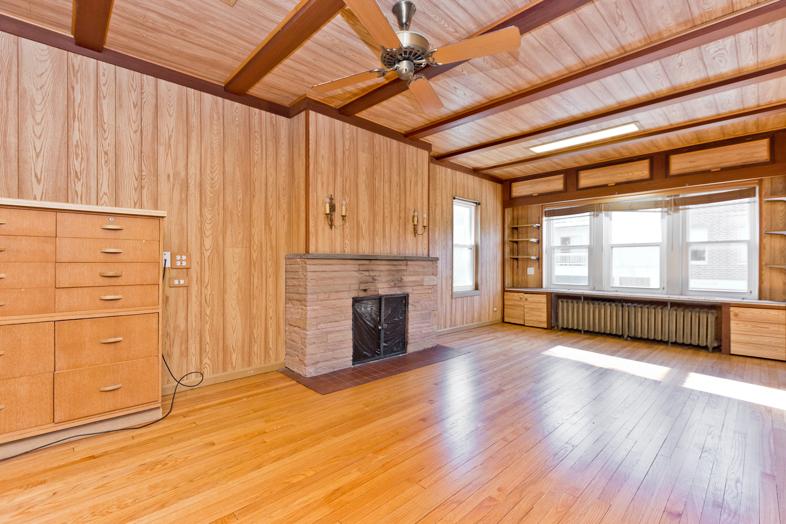 2950 Central Street, Unit 2 Evanston, IL 60201 - Photo 7 of 17 a view of an empty room with a fireplace and a window