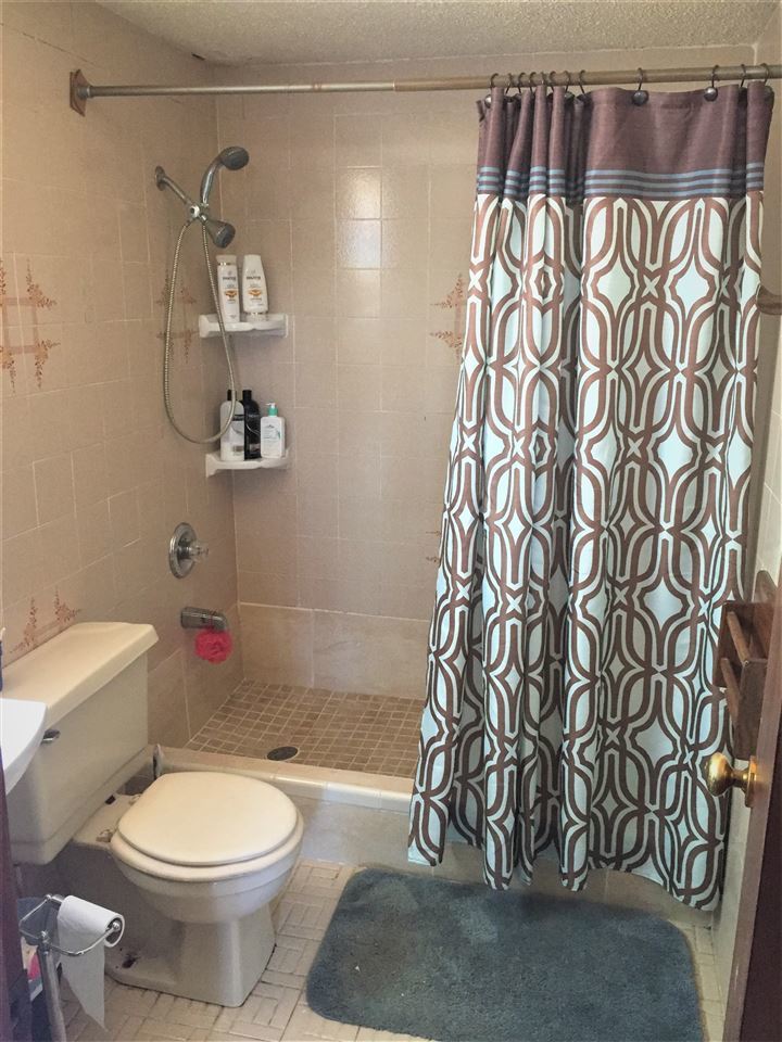 502 Rio Morava Rio Bravo, TX 78046 - Photo 16 of 20 a bathroom with a toilet and a shower