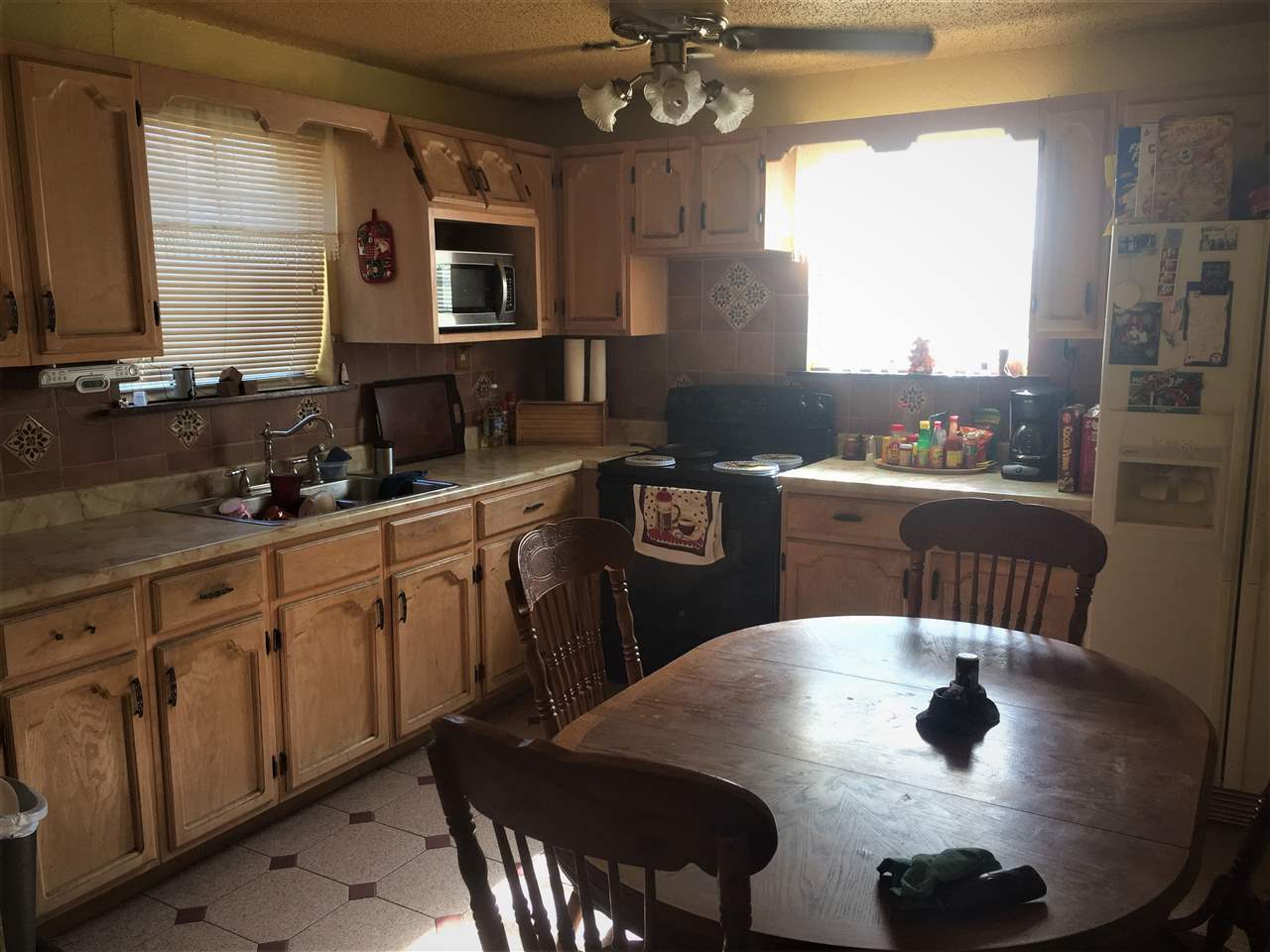 502 Rio Morava Rio Bravo, TX 78046 - Photo 17 of 20 a kitchen with a stove a sink a dining table and chairs
