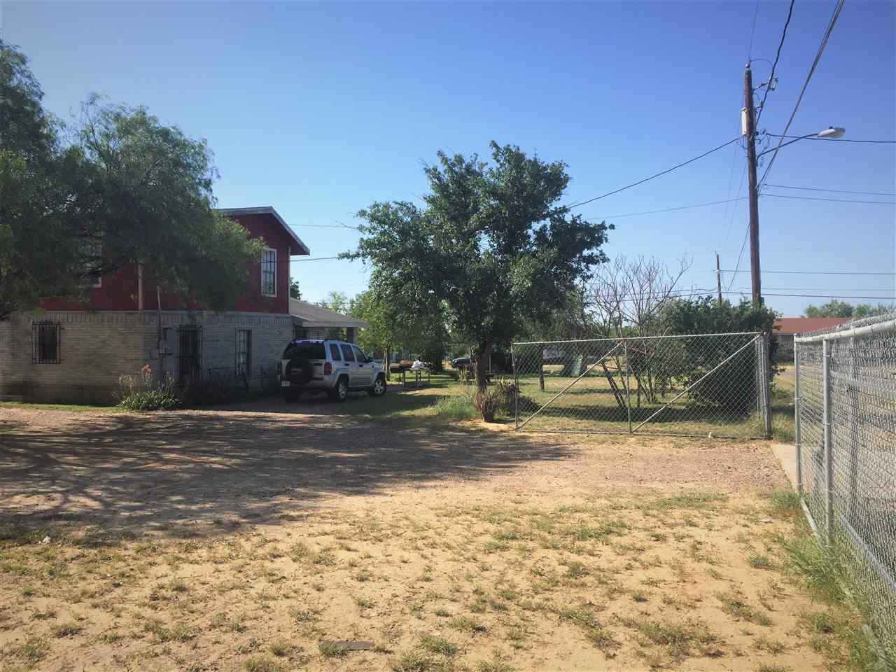 502 Rio Morava Rio Bravo, TX 78046 - Photo 6 of 20 a view of a yard with wooden fence