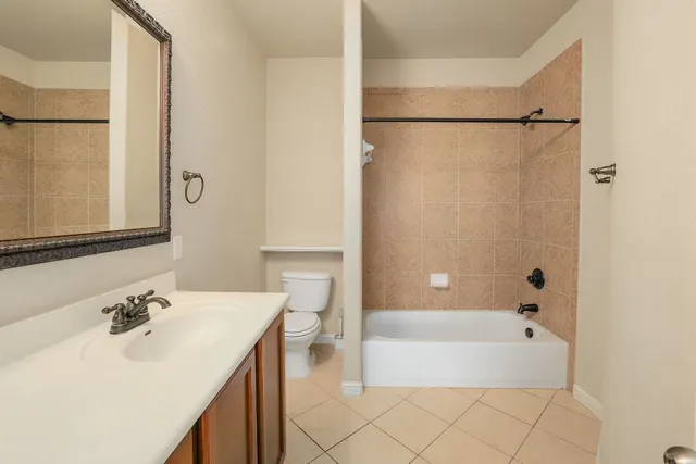 a bathroom with a sink a mirror and a bathtub
