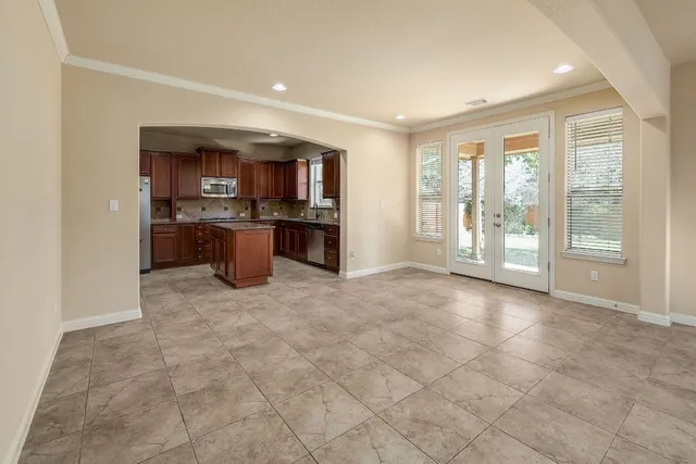 a view of a kitchen with a sink and a refrigerator