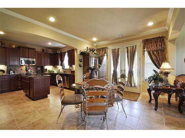 3313 Pine Needle Circle Round Rock, TX 78681 - Photo 5 of 12 a living room with lots of furniture and kitchen view