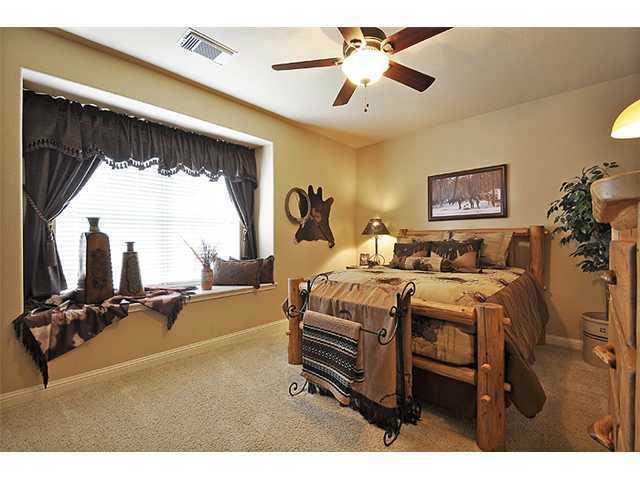 3313 Pine Needle Circle Round Rock, TX 78681 - Photo 6 of 12 a bed room with a bed mirror and a window