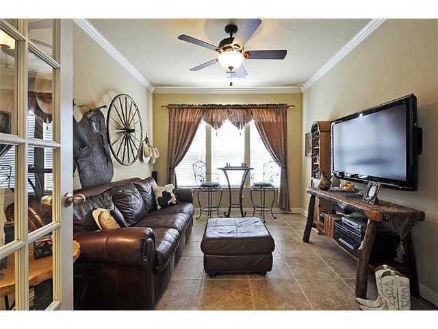 3313 Pine Needle Circle Round Rock, TX 78681 - Photo 7 of 12 a living room with furniture and a flat screen tv