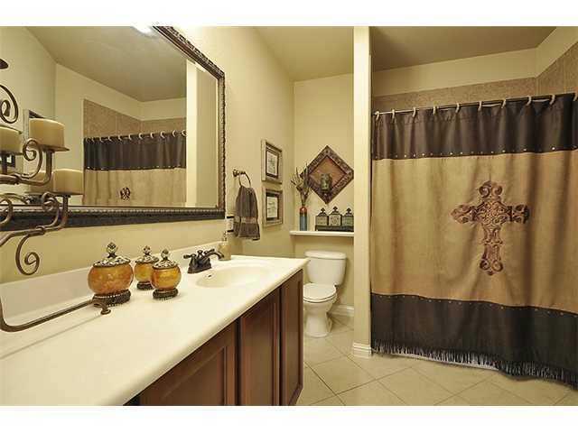 3313 Pine Needle Circle Round Rock, TX 78681 - Photo 9 of 12 a bathroom with a sink a toilet and a mirror