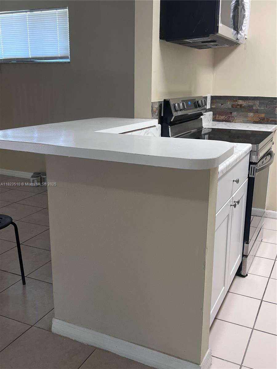 Crossings of Boynton Beach Condominiums Boynton Beach, FL 33435 - Photo 12 of 24 a utility room with dryer and washer