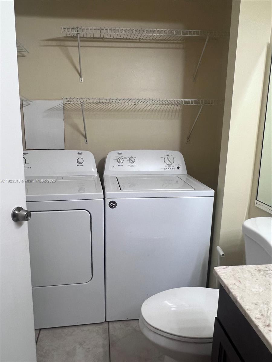 Crossings of Boynton Beach Condominiums Boynton Beach, FL 33435 - Photo 7 of 24 a utility room with dryer and washer