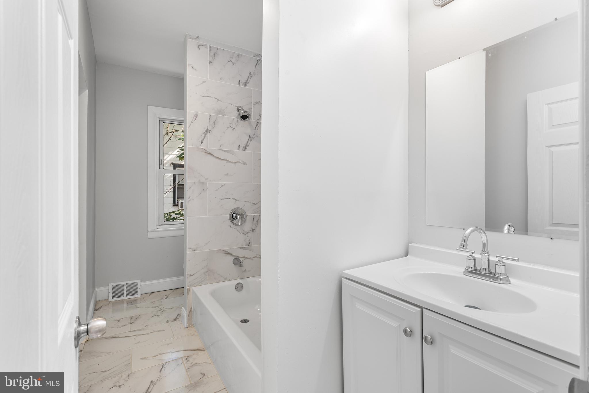 623 West 3rd Street Florence, NJ 08518 - Photo 23 of 36 a bathroom with a granite countertop sink a toilet and shower