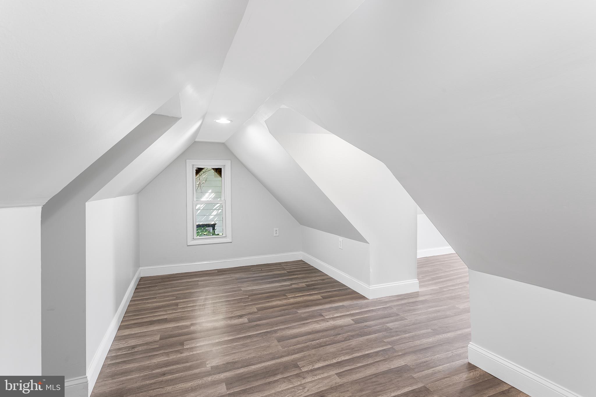 623 West 3rd Street Florence, NJ 08518 - Photo 28 of 36 a view of an empty room with wooden floor and a window