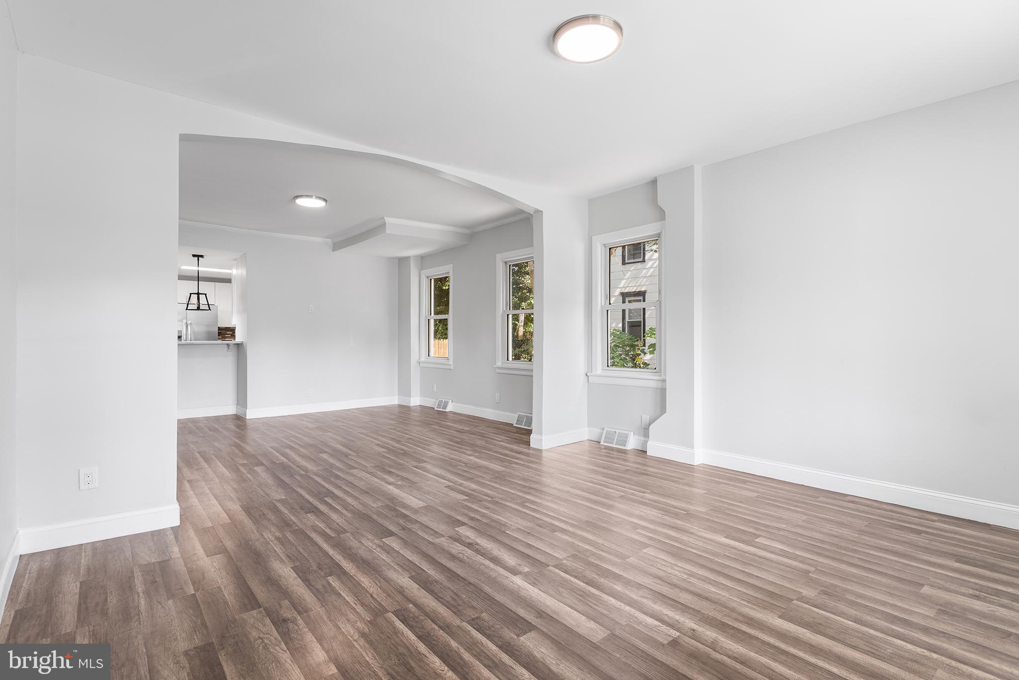 623 West 3rd Street Florence, NJ 08518 - Photo 5 of 36 a view of an empty room with wooden floor and a window