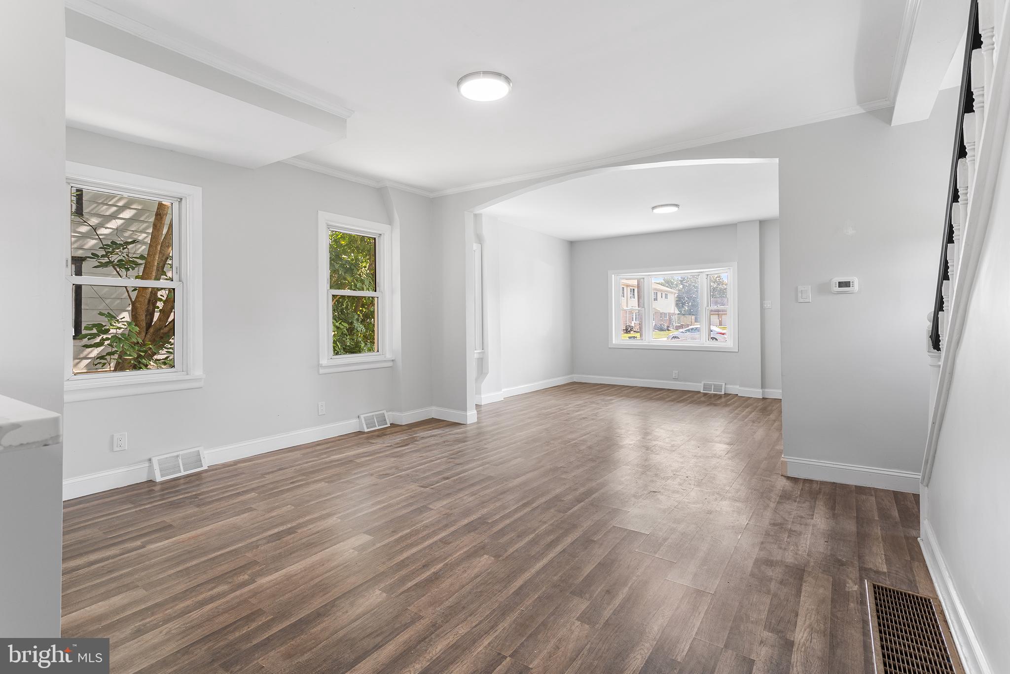 623 West 3rd Street Florence, NJ 08518 - Photo 10 of 36 an empty room with wooden floor and windows