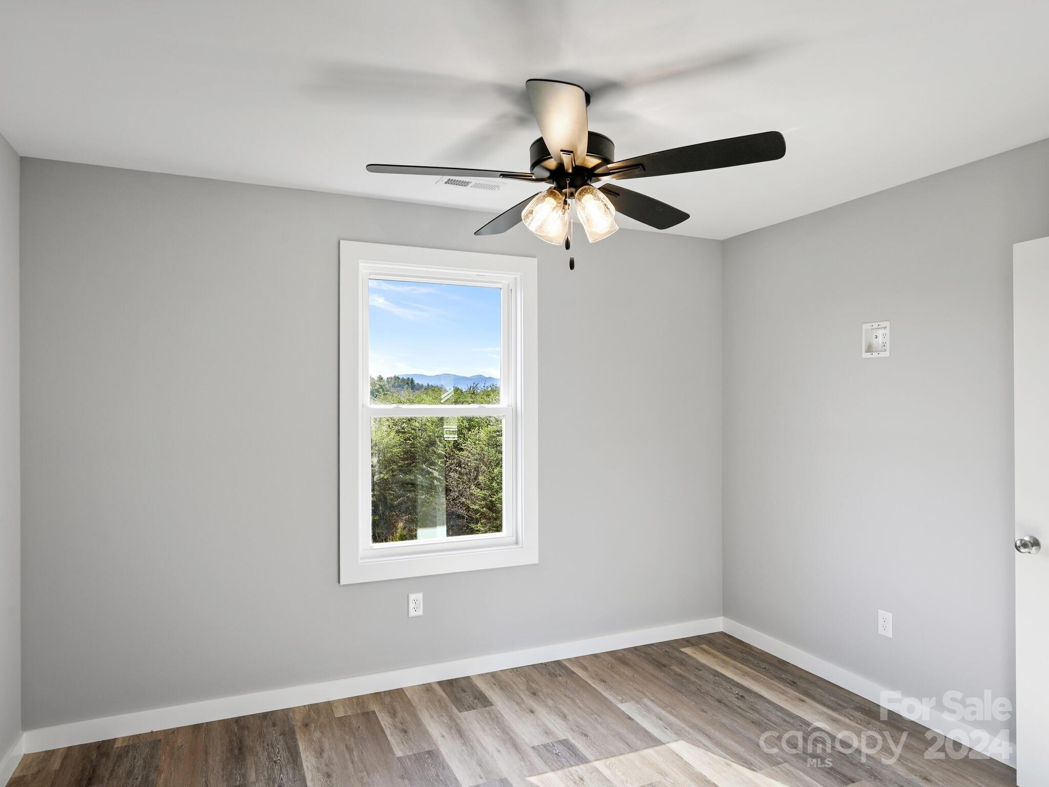 37 Sage Crest Loop Weaverville, NC 28787 - Photo 16 of 33 an empty room with a window and a fan