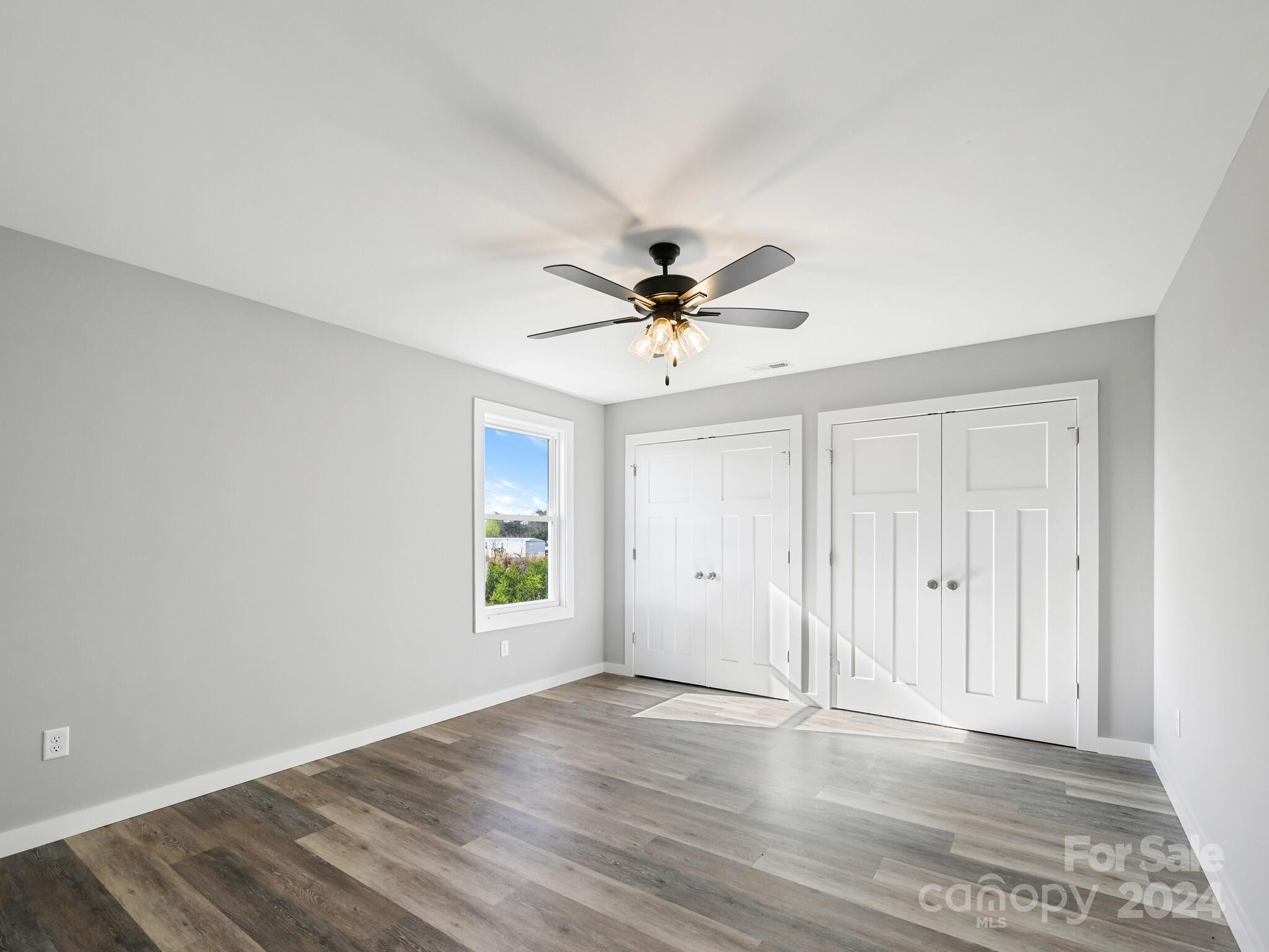 37 Sage Crest Loop Weaverville, NC 28787 - Photo 18 of 33 a view of an empty room with window and wooden floor