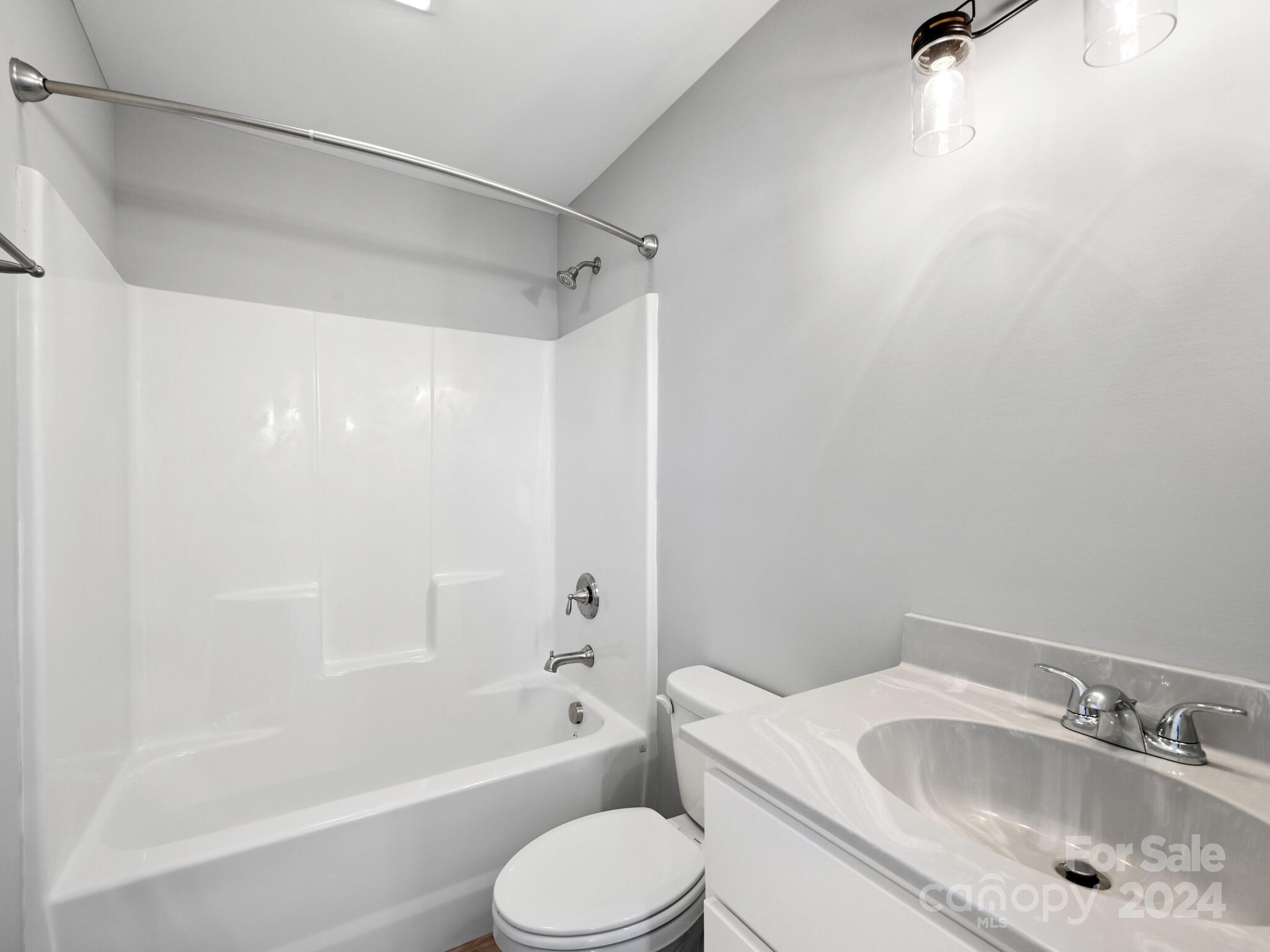 37 Sage Crest Loop Weaverville, NC 28787 - Photo 19 of 33 a bathroom with a sink toilet and shower