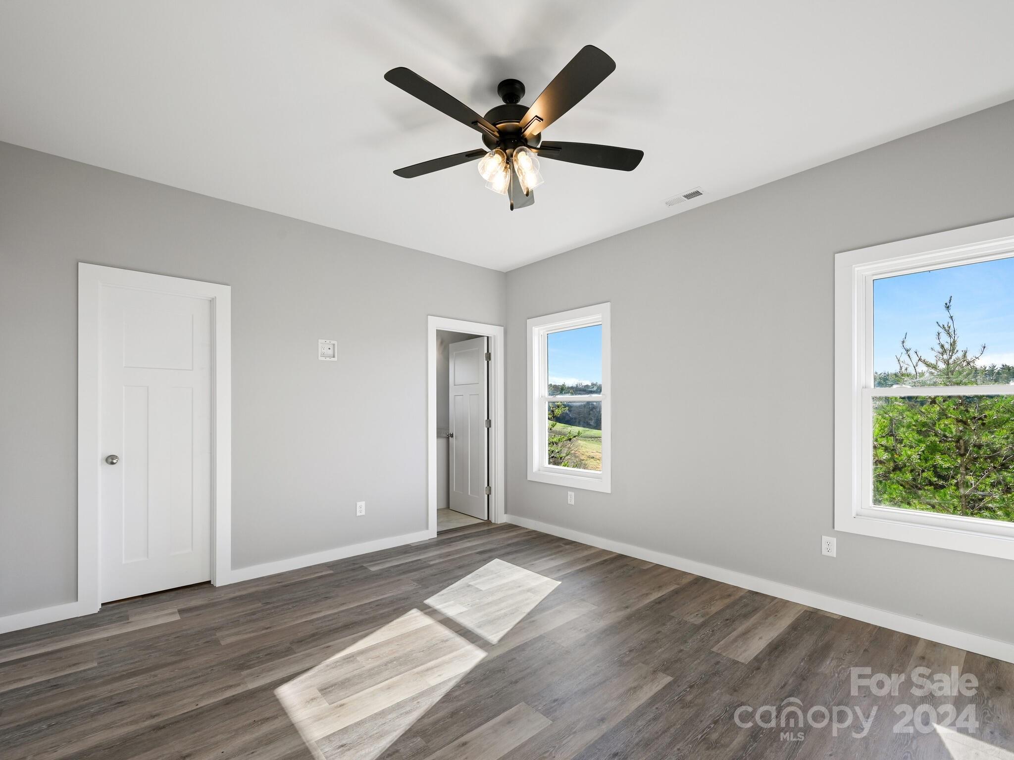 37 Sage Crest Loop Weaverville, NC 28787 - Photo 21 of 33 a view of empty room with wooden floor and ceiling fan