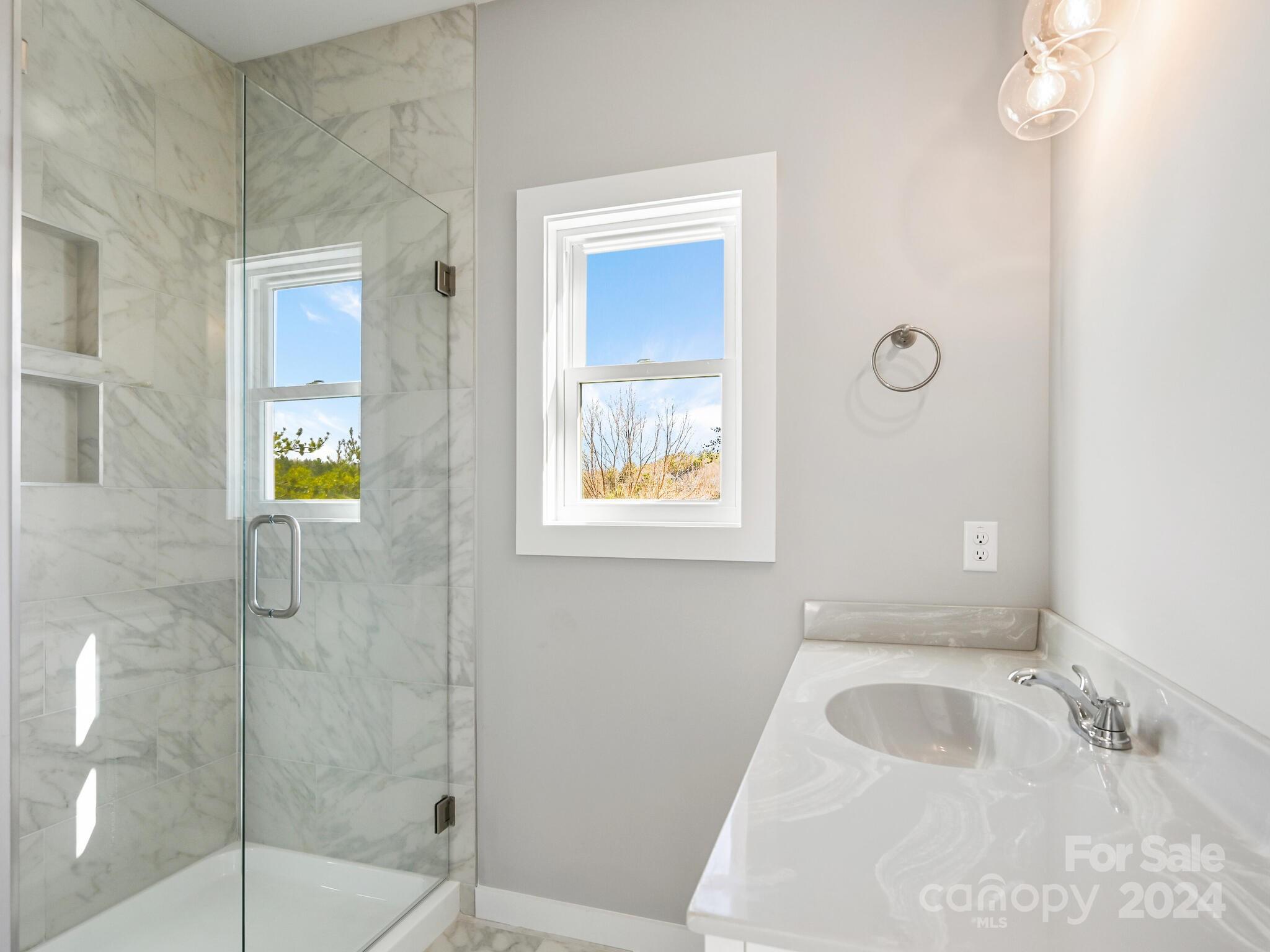 37 Sage Crest Loop Weaverville, NC 28787 - Photo 22 of 33 a bathroom with a sink and a shower
