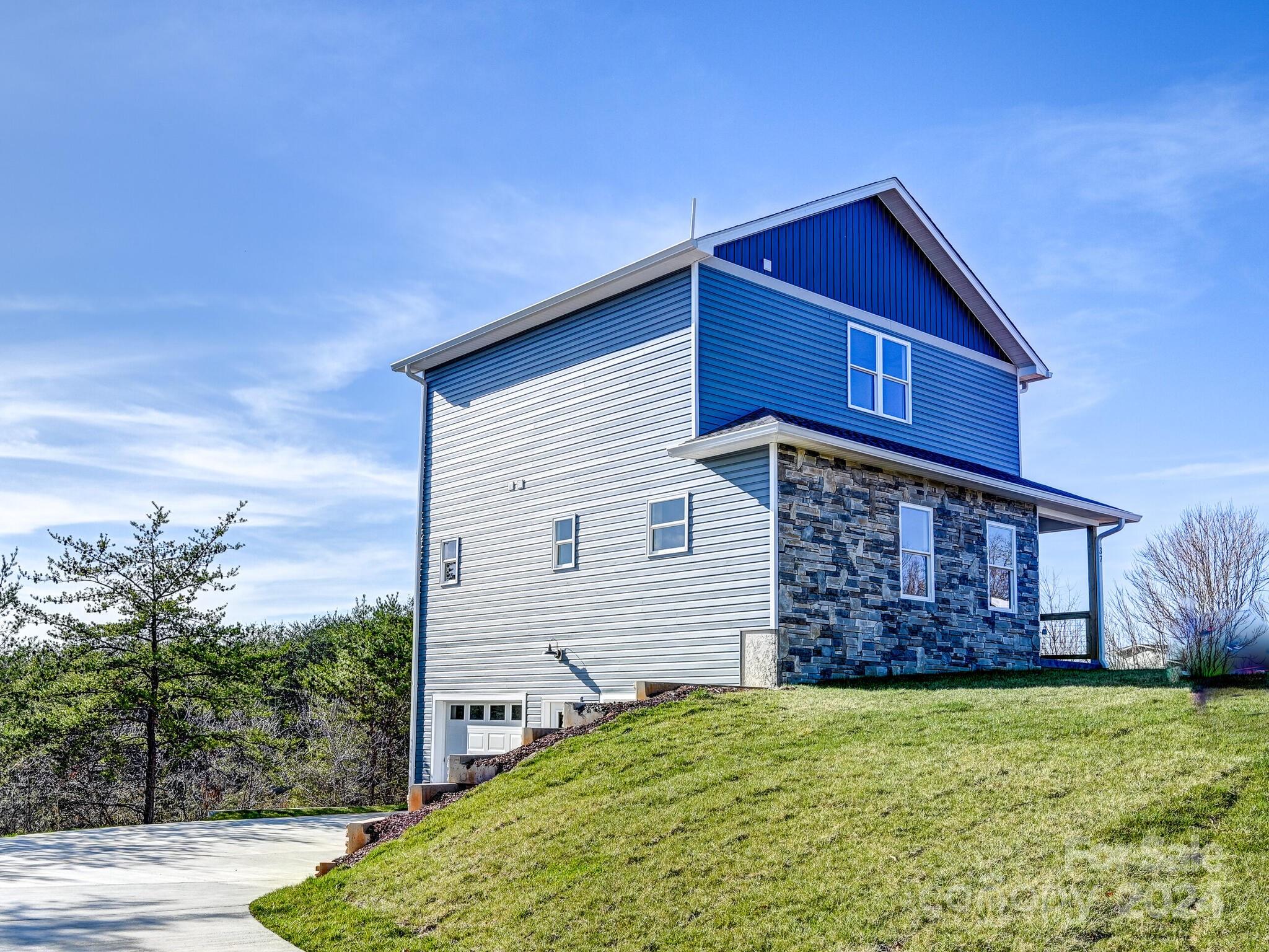 37 Sage Crest Loop Weaverville, NC 28787 - Photo 28 of 33 a front view of a house with garden