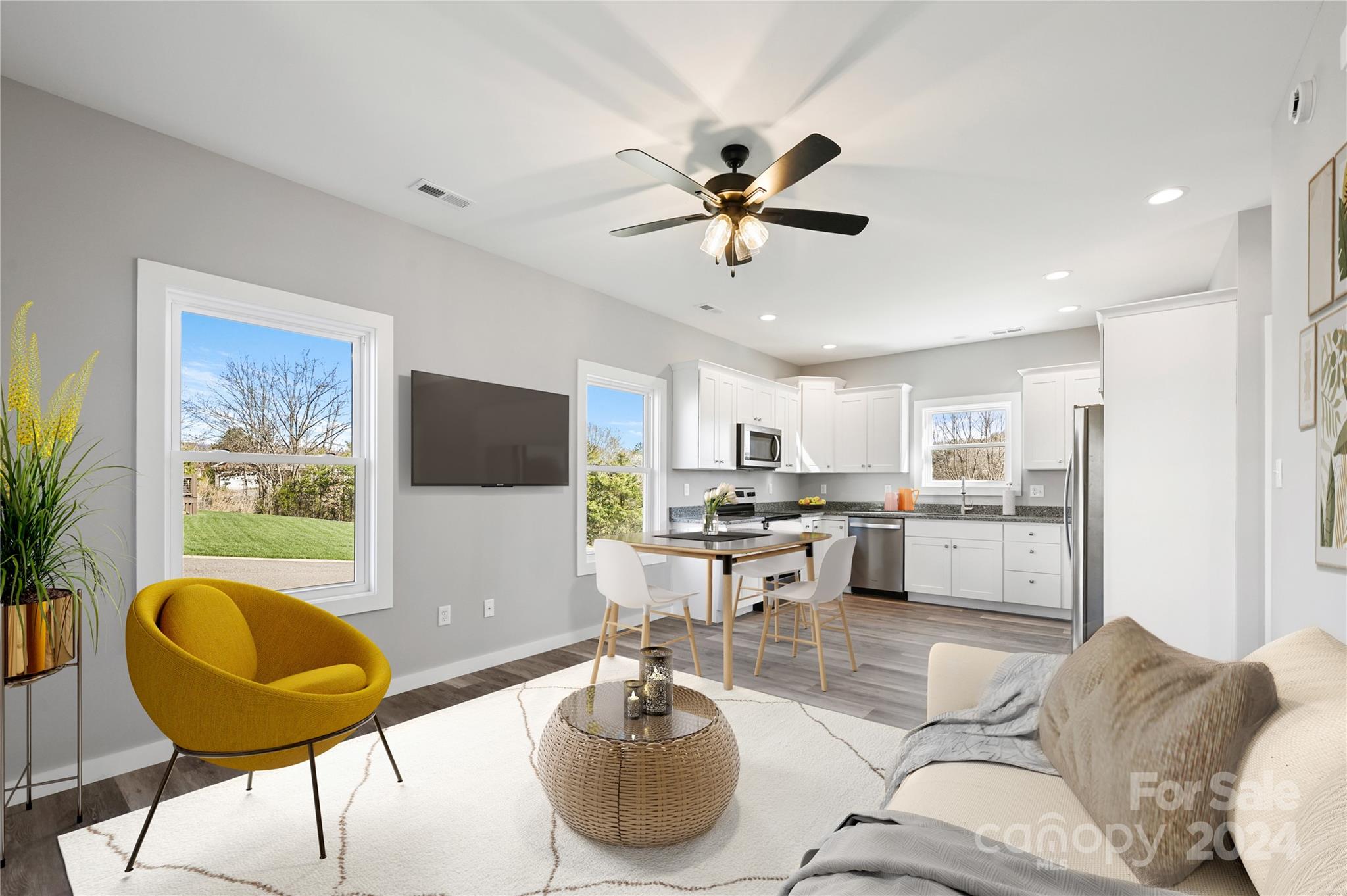 37 Sage Crest Loop Weaverville, NC 28787 - Photo 4 of 33 a living room with stainless steel appliances furniture and a flat screen tv