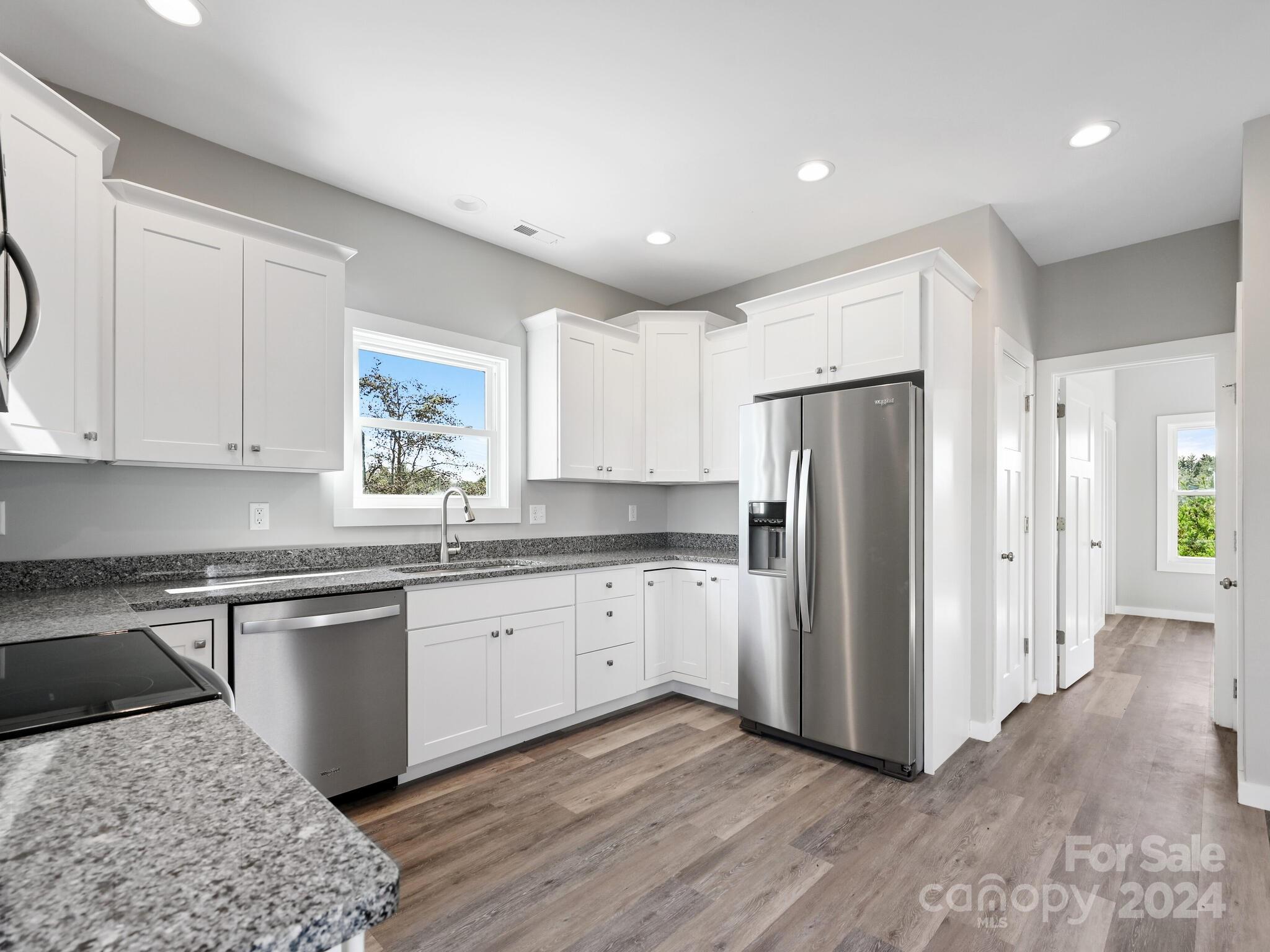 37 Sage Crest Loop Weaverville, NC 28787 - Photo 7 of 33 a kitchen with stainless steel appliances granite countertop a refrigerator and a stove top oven