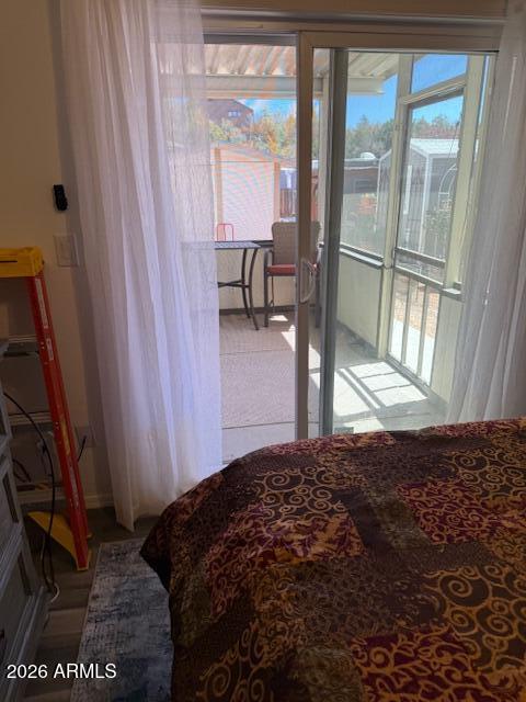 3933 Highway 260, Unit 242 Payson, AZ 85541 - Photo 15 of 30 a bedroom with a bed and large window