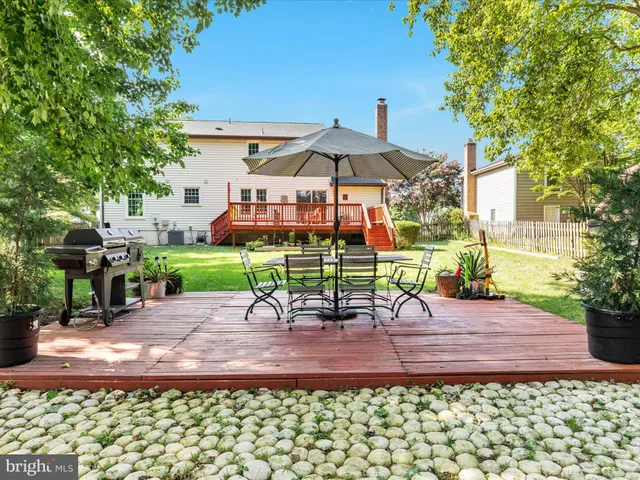 a view of a table and chairs under an umbrella
