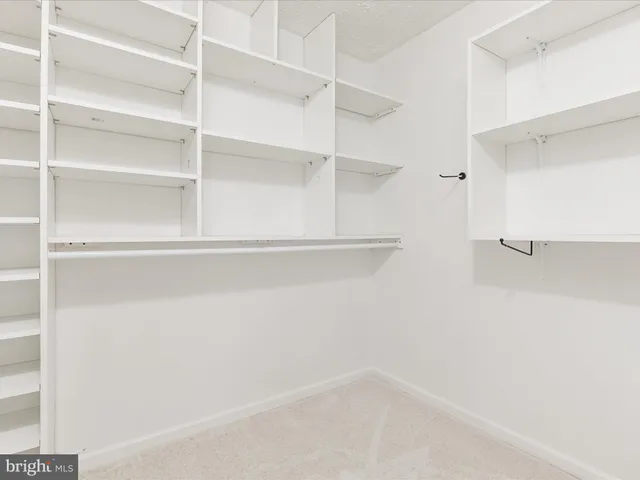 a empty closet with white paint